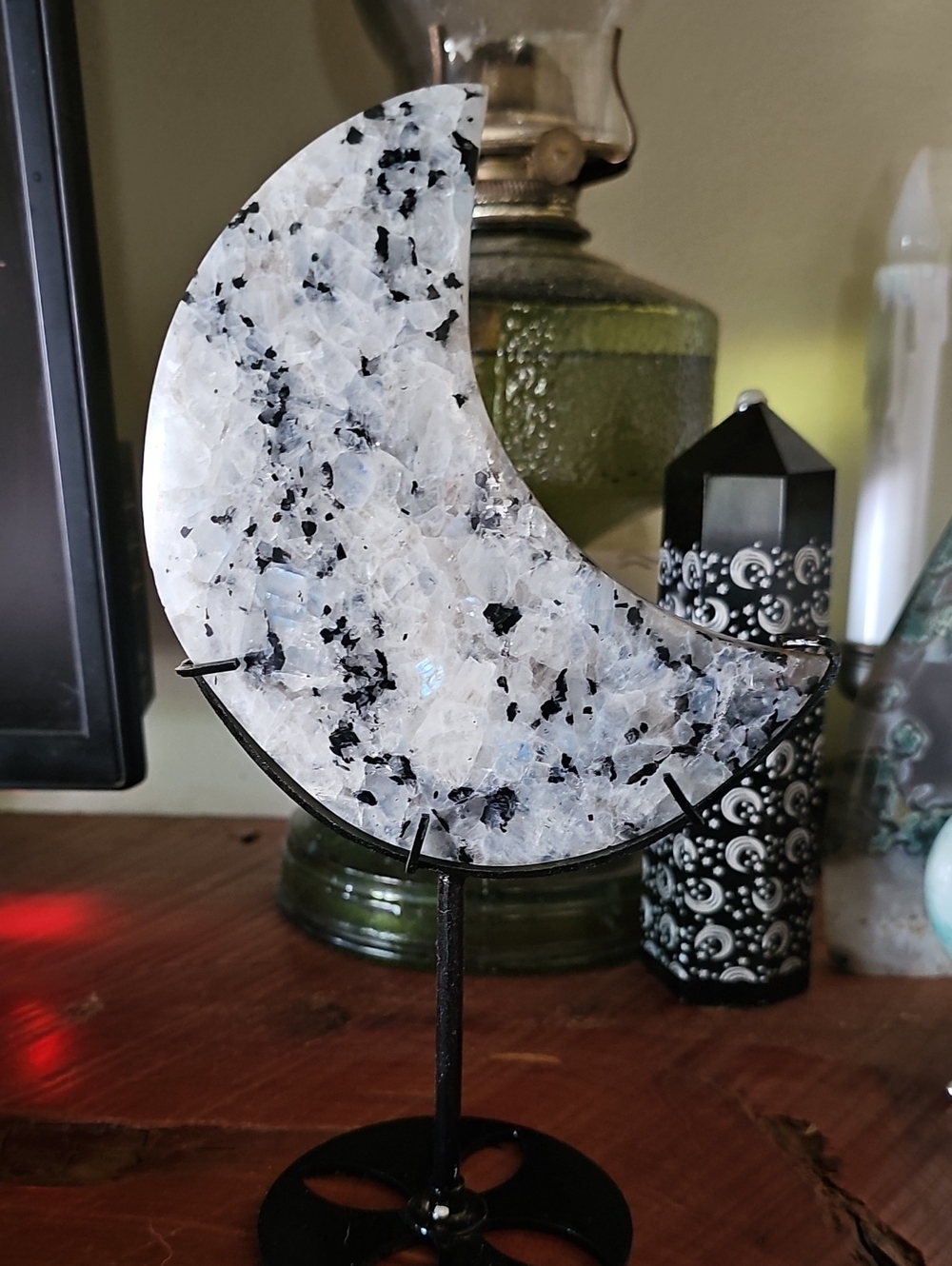Moon-Shaped Rainbow Moonstone Display on Stand - White & Black Speckled